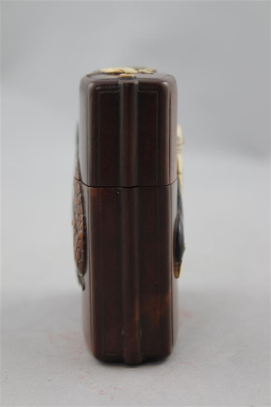 A Japanese cherrywood, ivory, horn, mother of pearl and wood inlaid single case inro, 19th century, 9cm.
